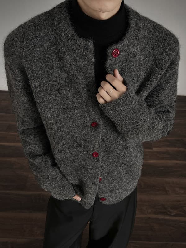 Clean and well-fitting dark gray Chanel-style cardigan sweater for men, a stylish and relaxed knitted short jacket.