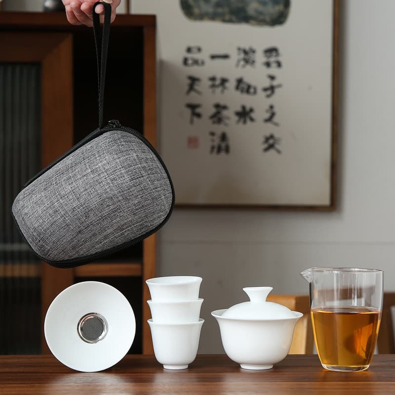 Dehua white porcelain travel Kung Fu tea set, portable bag, one bowl and four cups, glass quick cup, gift set, logo can be customized.