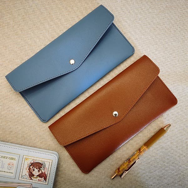 Manufacturer wholesale solid color PU leather large capacity makeup tool storage bag student pencil bag business gift bag