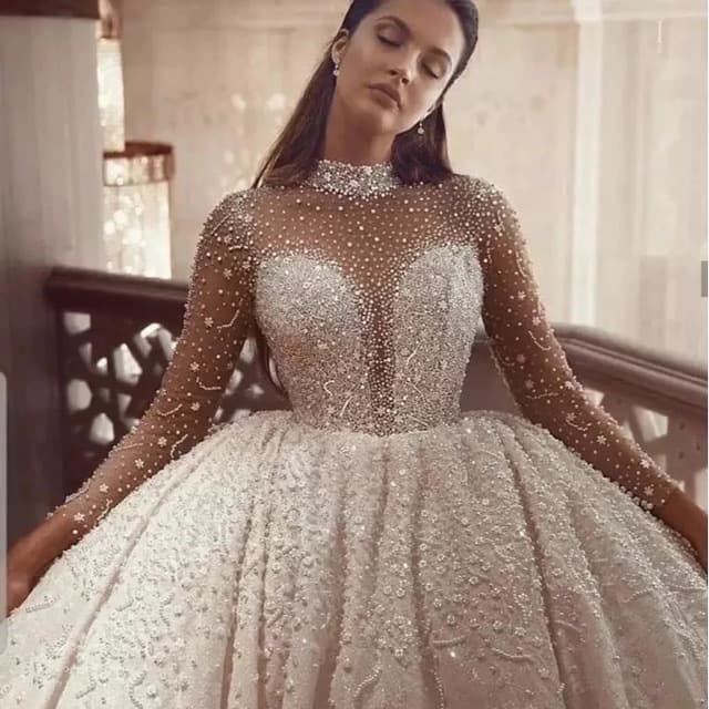 New European and American Plus Size See-through Strapless Wedding Dress 2026 New Beaded Sleeve Puffy Main Wedding Dress Long Train Wholesale