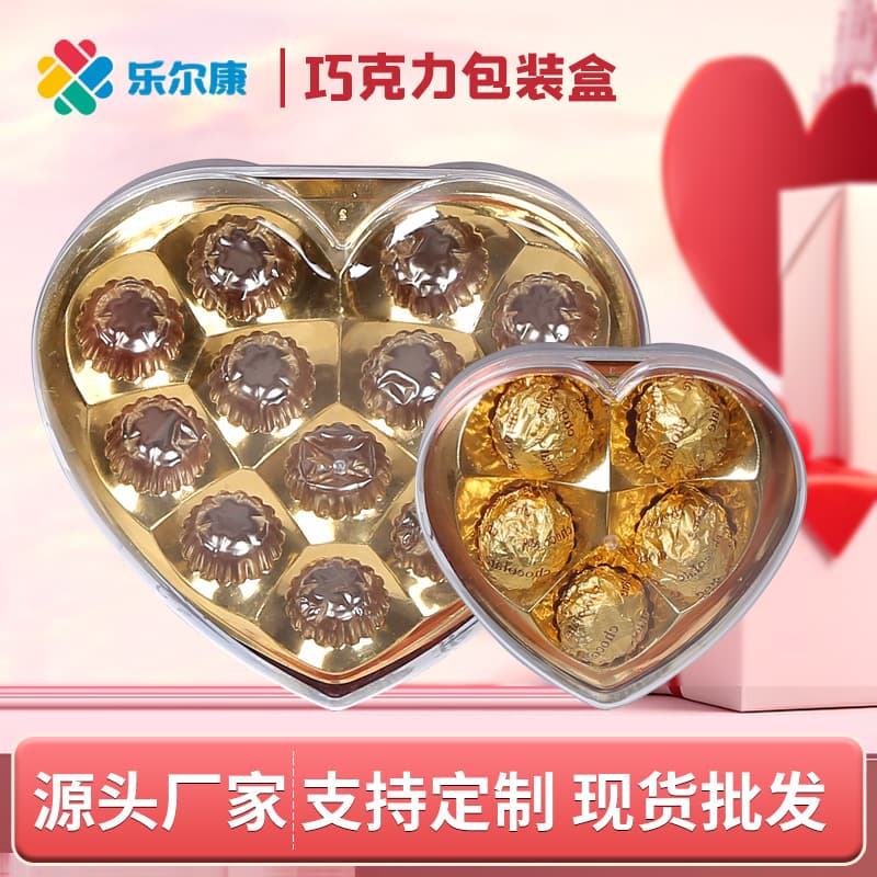 Customized chocolate packaging boxes (3/5/8/12 pieces) in gold heart shape, PS injection molded transparent heart shape.