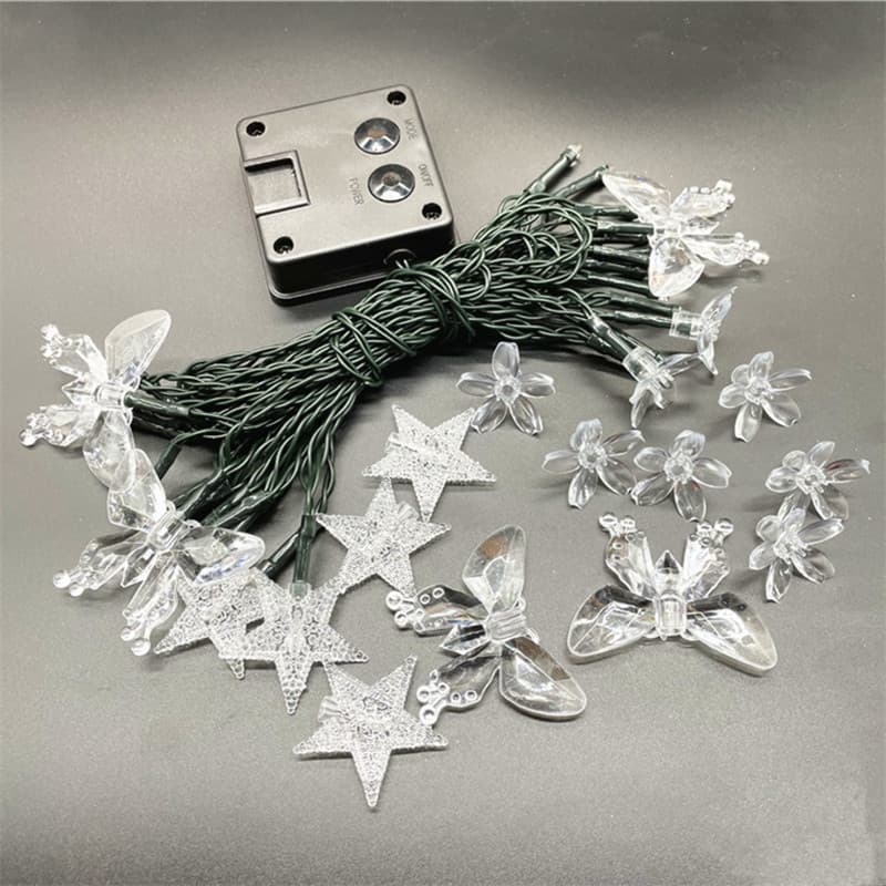 Wholesale colored light plastic accessories, string light floral hanging inserts, bubble balls, spheres, stars, bees, droplets, and snowflakes.