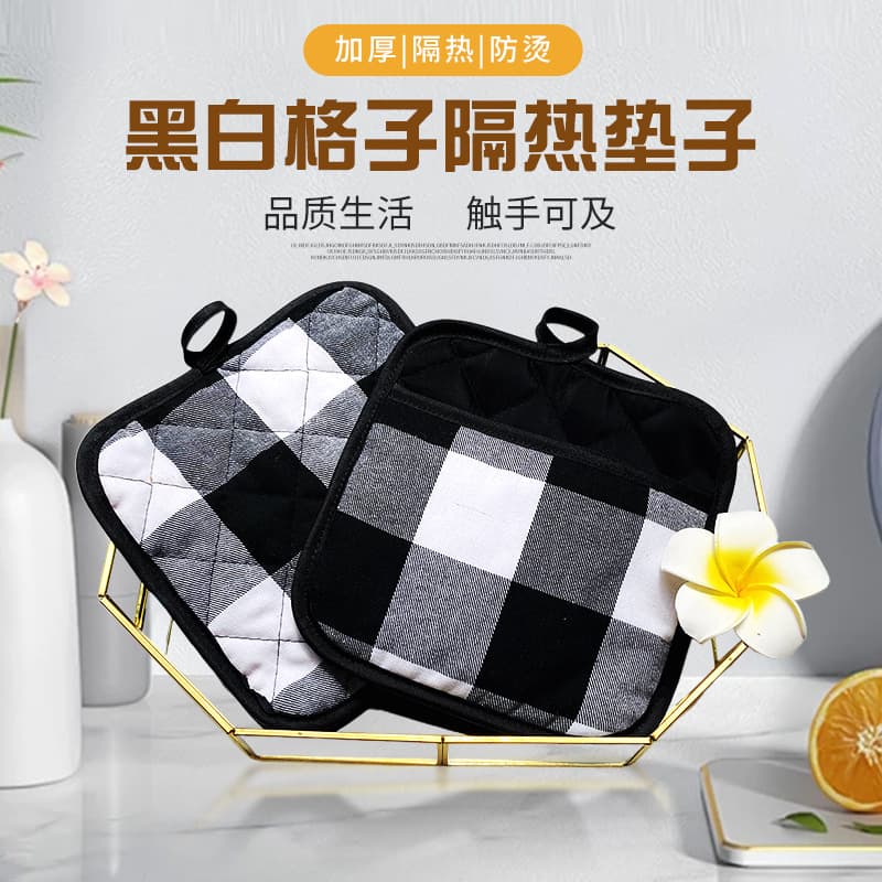 Scalding and heat-insulating black and white checkered mat, thickened, dual-use for kitchens, microwaves, dining tables, and home use. (Amazon)