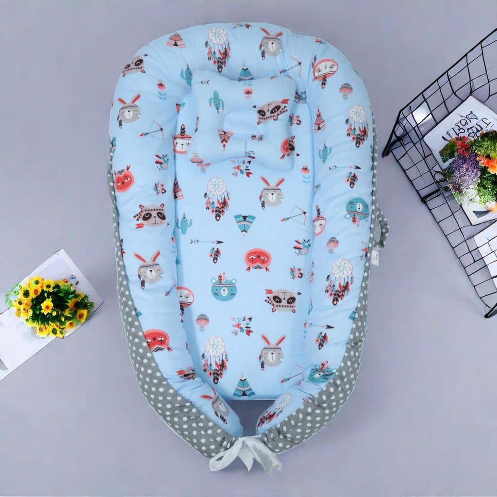 Portable detachable bed-in-bed temporary diaper changing table baby changing table cotton fabric bionic bed that is removable and washable.