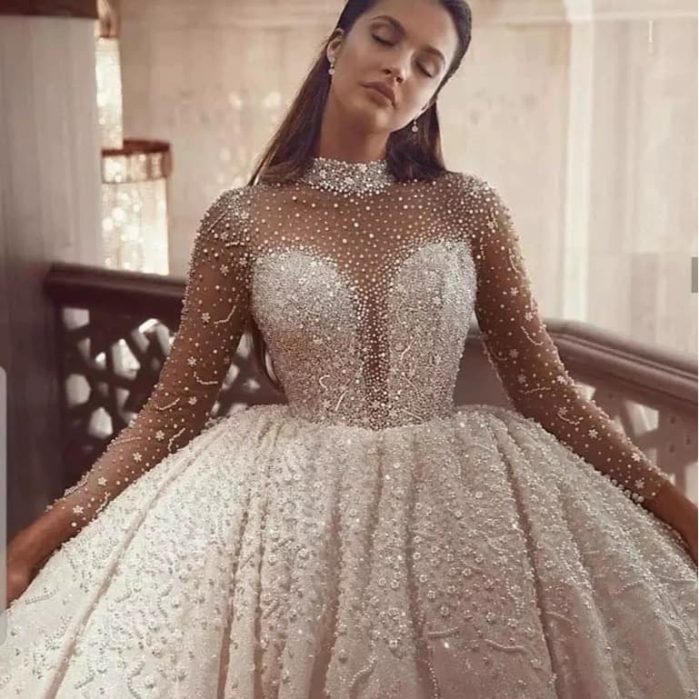 New European and American Plus Size See-through Strapless Wedding Dress 2026 New Beaded Sleeve Puffy Main Wedding Dress Long Train Wholesale