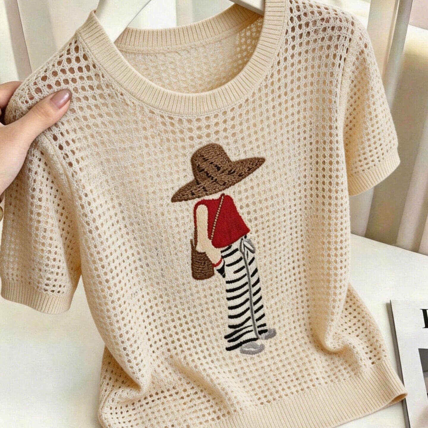 Cartoon Print Hollow Breathable Short-Sleeve Knit Top for Women 2026 Summer New Apricot Loose Round Neck Thin Style