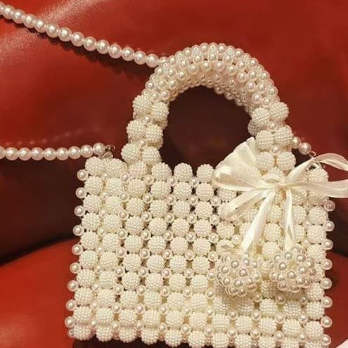 High-end fairy hand-beaded pearls, new temperament women's portable style, super European and American fashionable and versatile bag