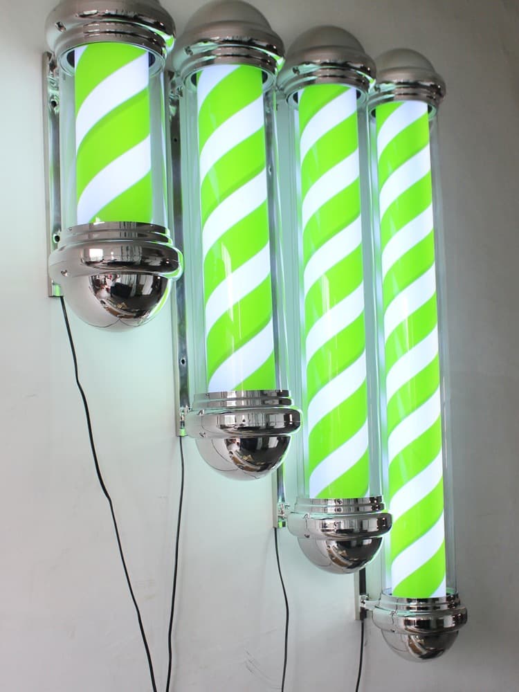 Cylindrical wall-mounted green LED rotating light for beauty and hair salons, sun-resistant.