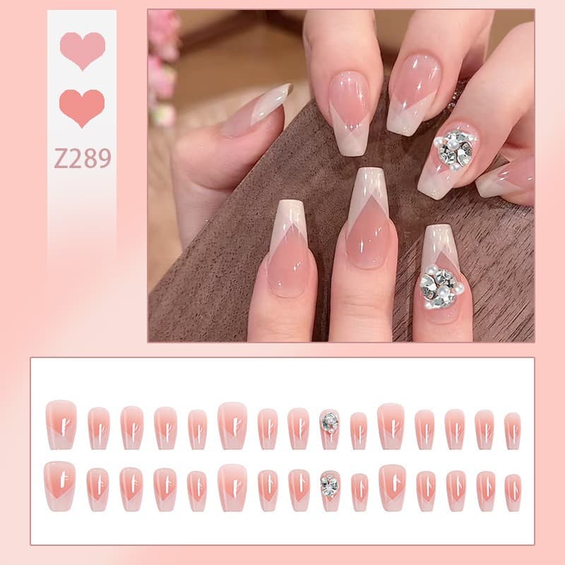 Sweet nude bridal nail tips with French pearl chain, elegant almond-shaped handmade press-on nails, finished product