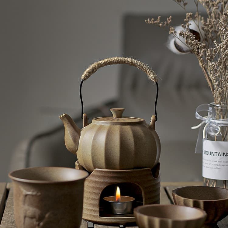 Old-fashioned wine warmer set with ceramic pot for yellow rice wine and liquor, including heating candle holder and cups