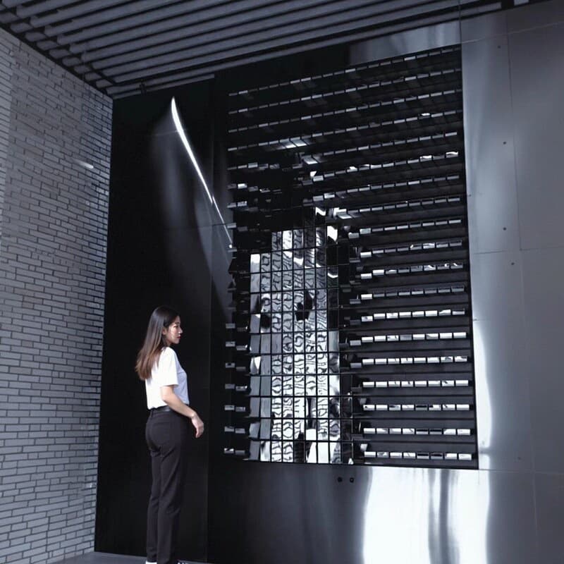 Mosaic technology matrix wall mechanical human interaction dynamic art installation axis flip panel corporate exhibition hall rotating screen