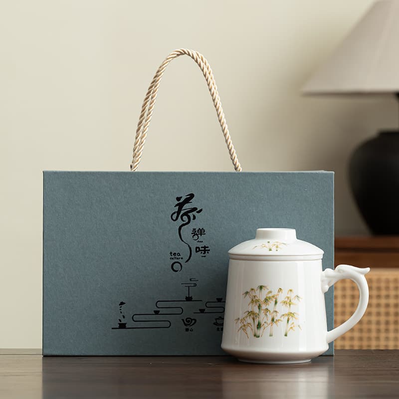 Dehua mutton fat jade company business gift mug with lid tea water separation tea cup ceramic can be customized with logo printing