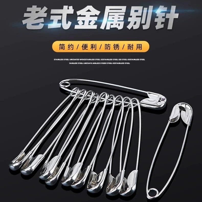 Vintage safety pins for clothing fastening in small, large, and extra-large sizes, doubling as paper clips or bed sheet clasps.