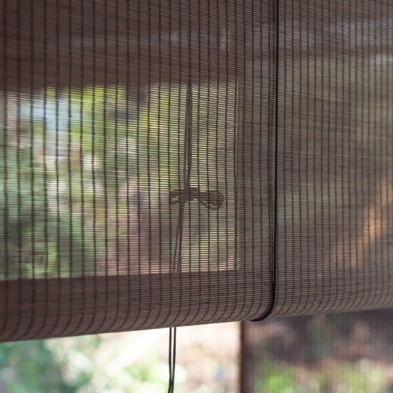 Outdoor bamboo roller blinds/curtains for gazebos, balconies, and tea rooms, providing sun protection. These bamboo blinds are coated with a clear varnish for waterproofing.