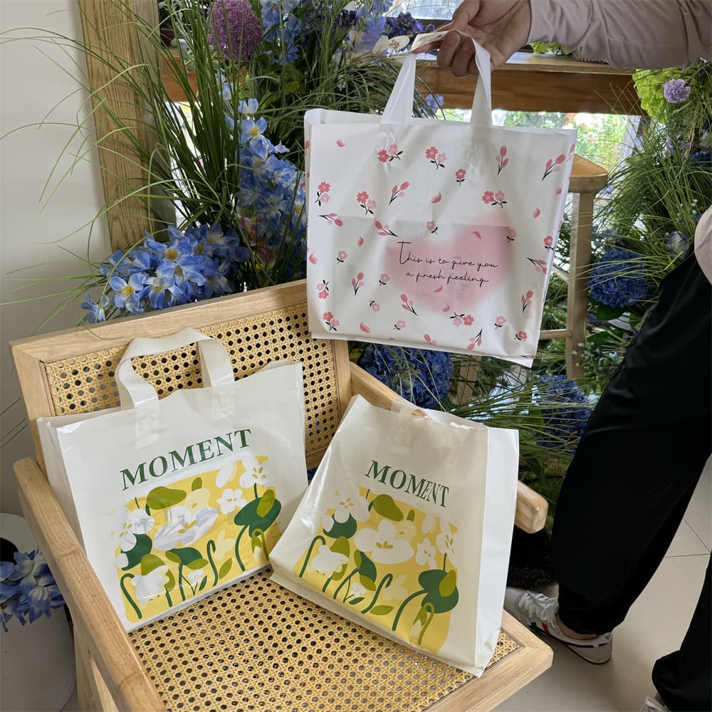 Cheap Plastic Handheld Shopping Bag Flower Design Clothing Store Gift Bag for Women Shoe Box Packaging Handbag from China