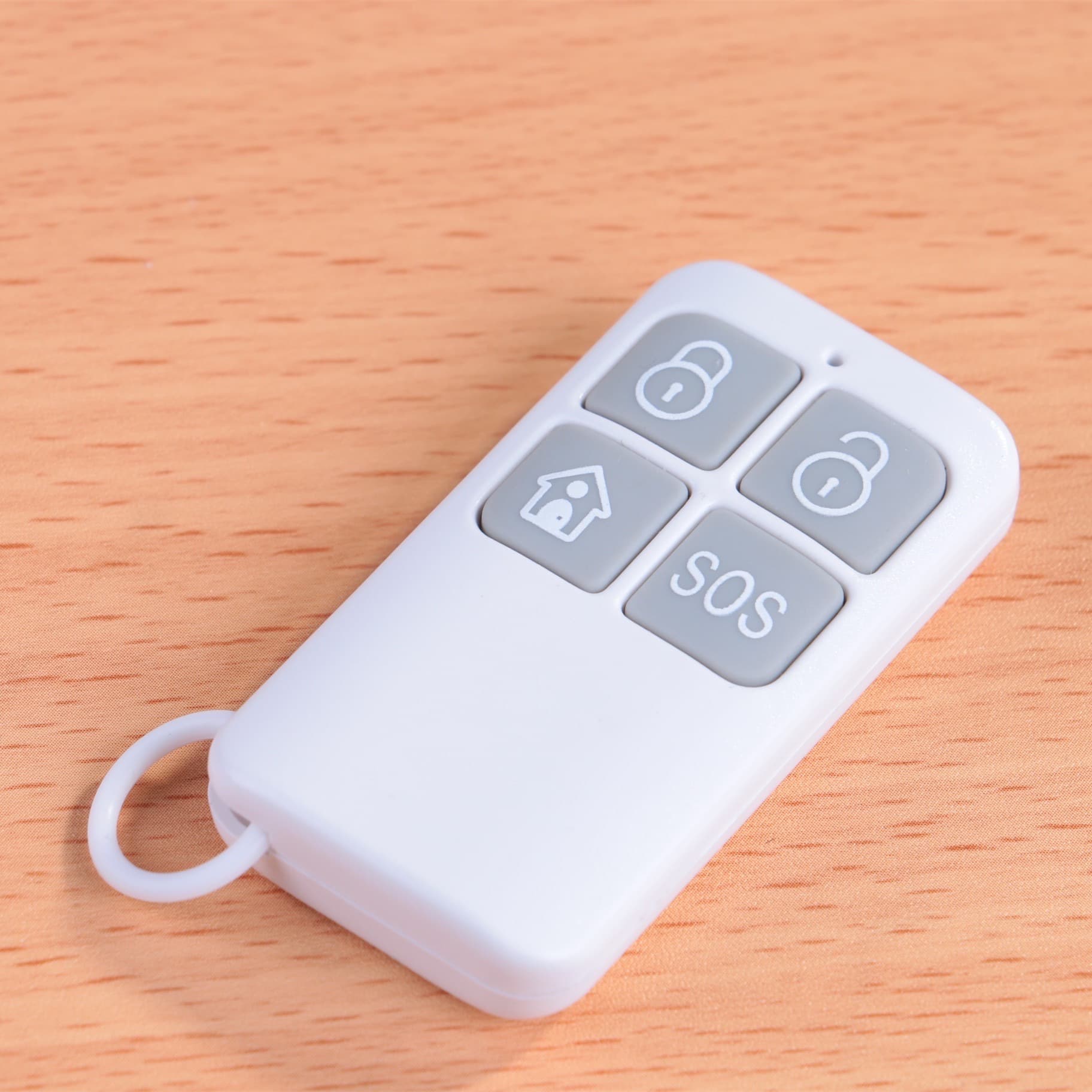 The four-button plastic remote control shell can be silk-printed with icons as required, alarm accessories, alarm