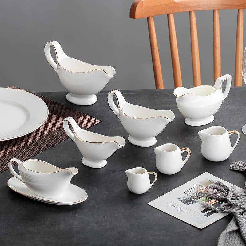 Phnom Penh Western-style tableware: saucepan, ceramic milk jug, espresso pitcher, milk cup, milk jug, sugar bowl, milk jug.