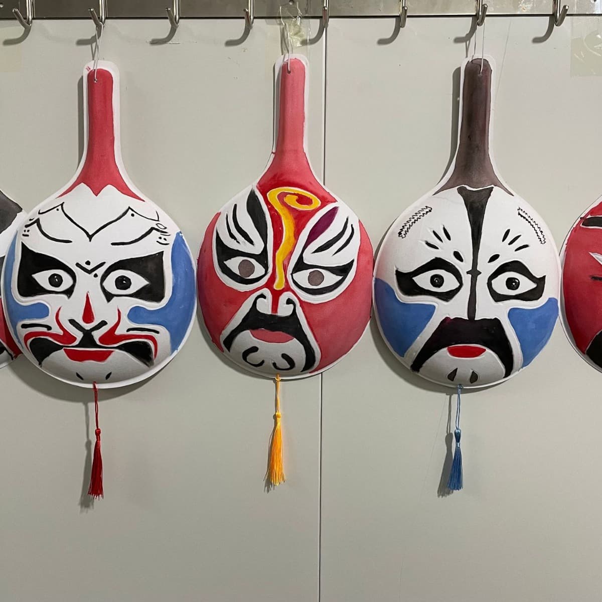 White indented Peking Opera mask large horse ladle with color chart included