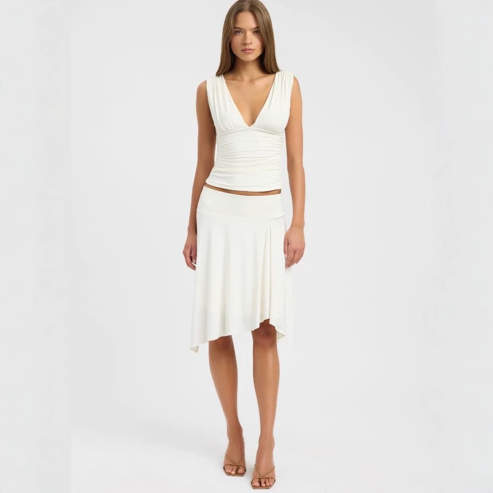 Seaside resort style solid color deep V-neck sleeveless pleated waist crop top + irregular skirt cross-border women's clothing