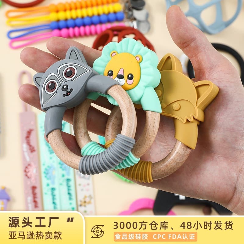 Amazon's new food grade silicone children's teether baby chewing gum baby cartoon beech wood molar stick wholesale