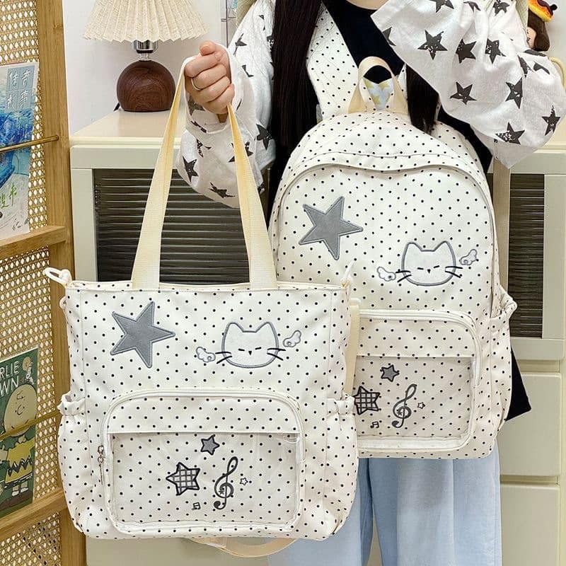 Korean version of ins cartoon angel kitten backpack female cute note polka dot bar Ji Guzi pain bag shoulder bag