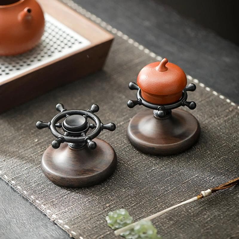 Creative ship's wheel ebony rotating handle lid for purple clay teapot and bowl accessories.