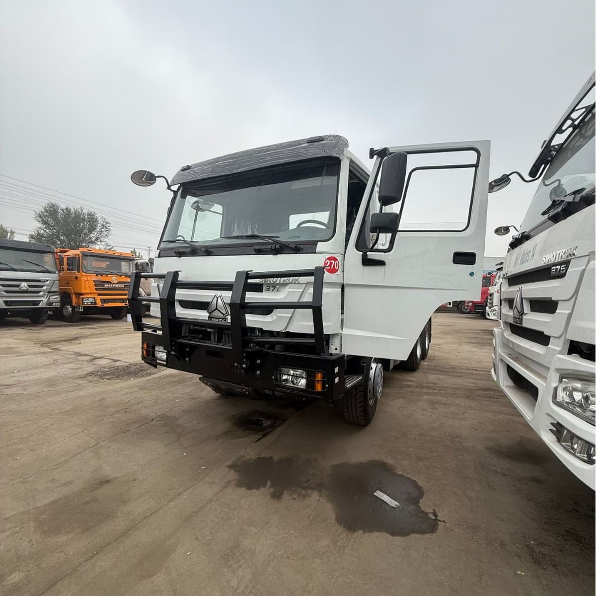 Exported refurbished HOWO tractor trucks, 371hp and 375hp models, compliant with China III emission standards, exported to Africa.
