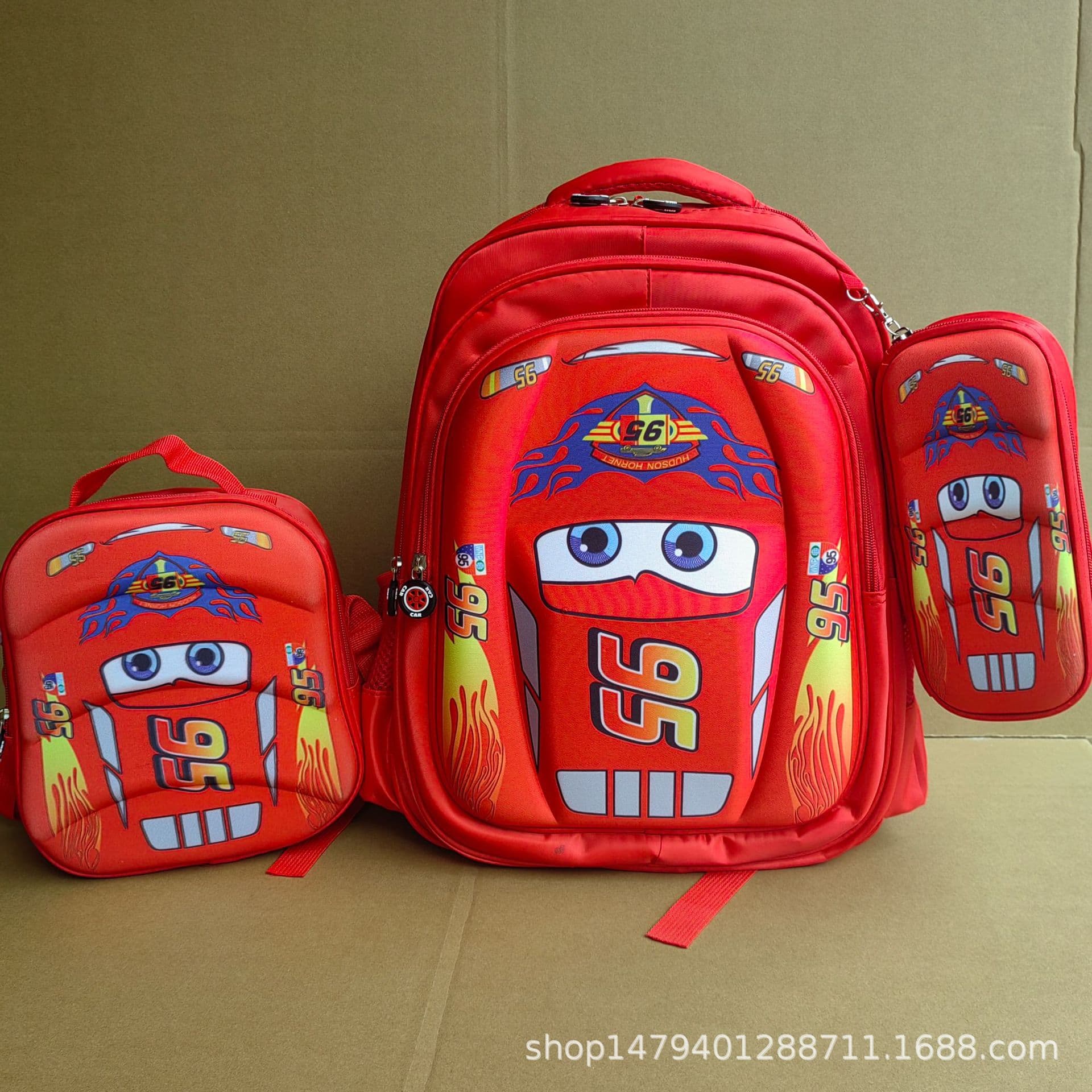 Three piece set of schoolbags for primary school students, cartoon 95 car lunch bag, large capacity pencil case, cross-border supply, dropshipping