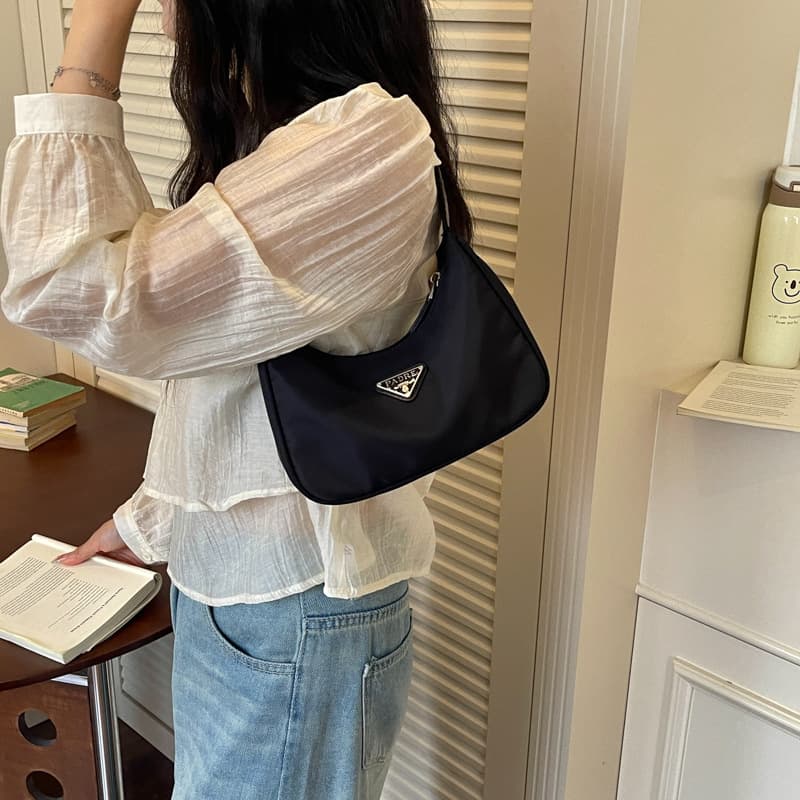 Wholesale Minimalist Retro Triangle Logo Nylon Underarm Bag 2026 New Crescent Small Bag Commuter Waterproof Shoulder Bag