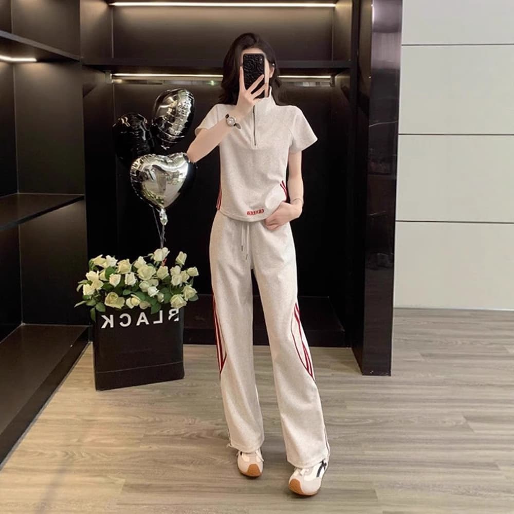 2025 new casual sports suit for women to reduce age and look slimming short-sleeved tops wide-leg pants summer wear with a complete set