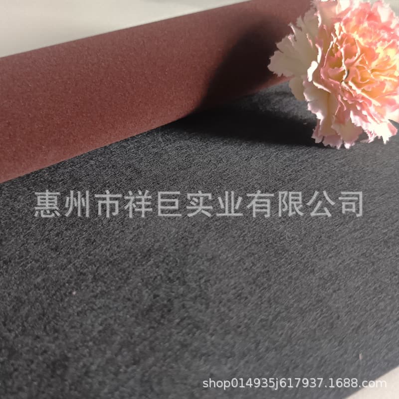 Custom needle-punched medium pile flocked fabric with self-adhesive backing for packaging, display cases, and interior applications.