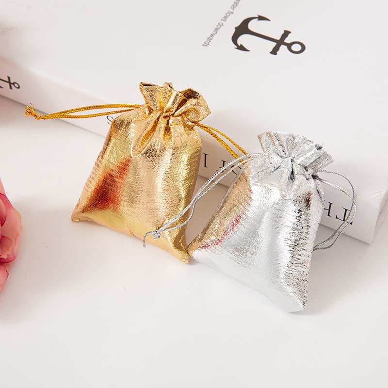 Customizable drawstring bags with gold/silver foil printing for jewelry, collectibles storage, dust protection, and gift packaging.