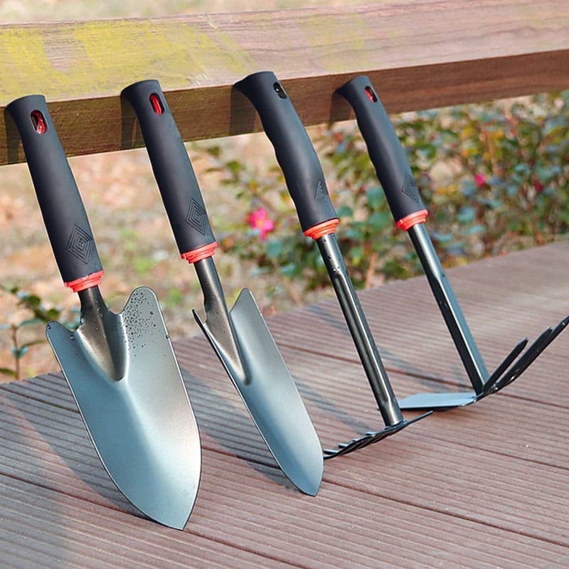 A three-piece set of tools for planting flowers, including a small rake, hoe, and spade, used for farming, beachcombing, gardening, and vegetable planting.