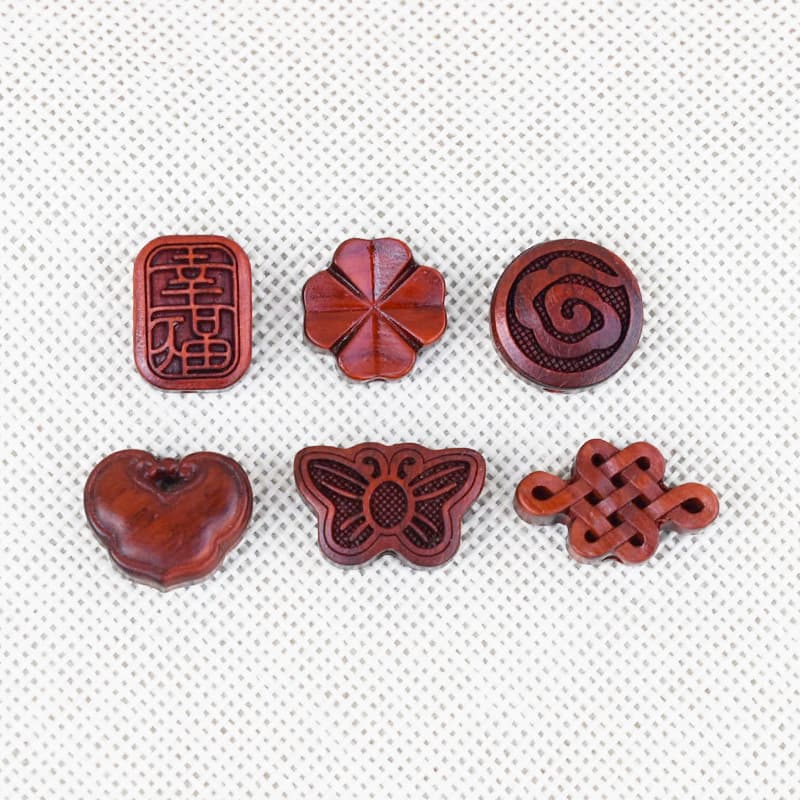 Hand-carved sandalwood accessories: pendants, Ruyi locks, butterflies, and DIY Chinese knot ornaments.