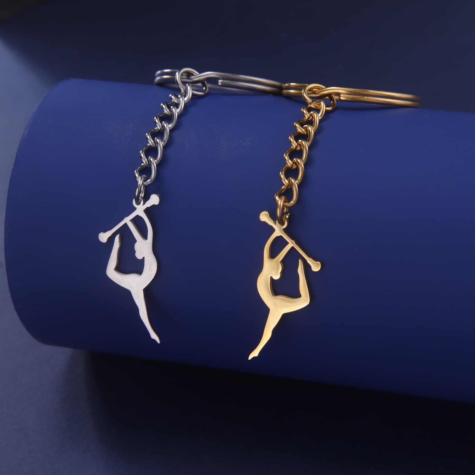 Cross-border new product titanium steel keychain sports souvenirs figure gymnastics stick keychain craft bag pendant