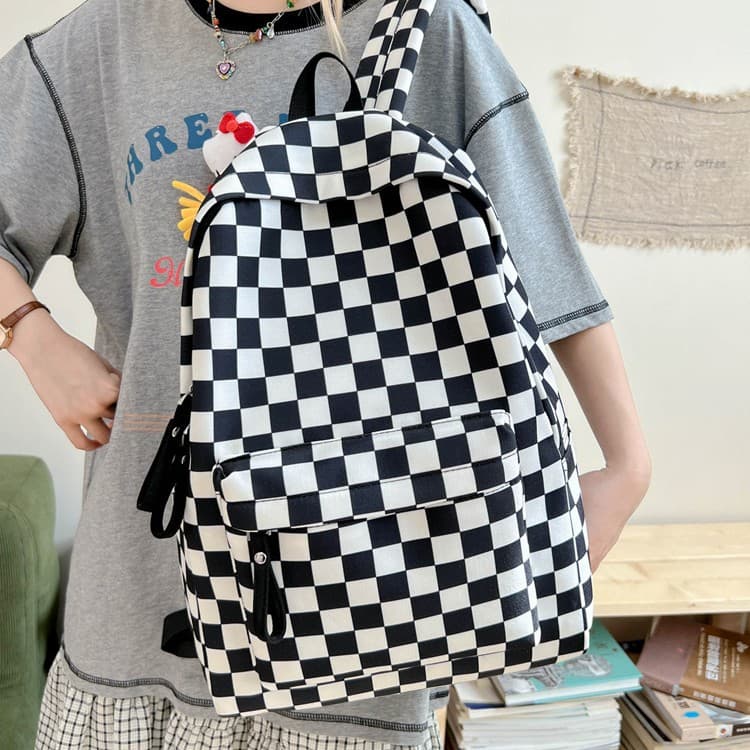 New simple ultra-light black and white checkerboard canvas bag for women, large capacity double-shoulder backpack, wholesale for primary and secondary school students