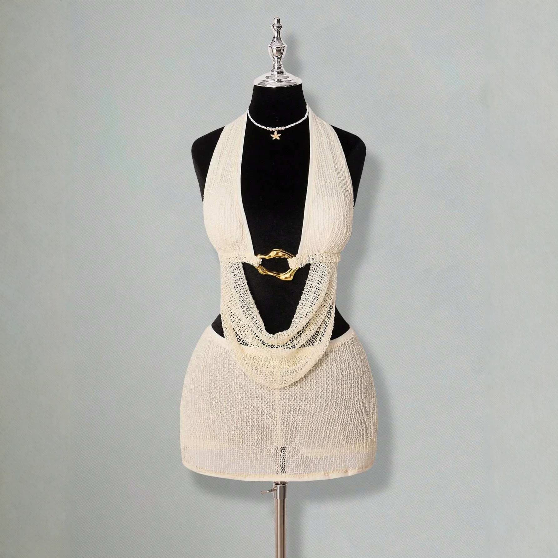 Cross-border sexy deep V halterneck knitted top, metal buckle hollow out and exposed navel holiday style camisole hip-covering skirt
