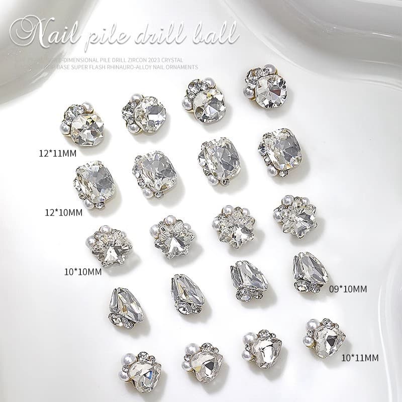 Piles of finished diamond balls, large diamonds for manicure, diamond jewelry, square crooked hearts, peach hearts, nail decorations, diamond bows