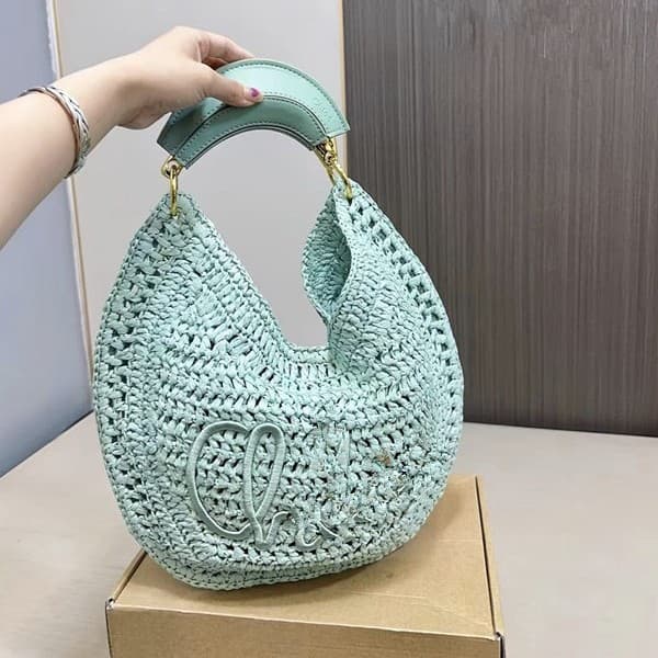 Cross-border Bohemian straw beach bag, niche design crescent bag, slim metal handle, hollow underarm bag, handmade