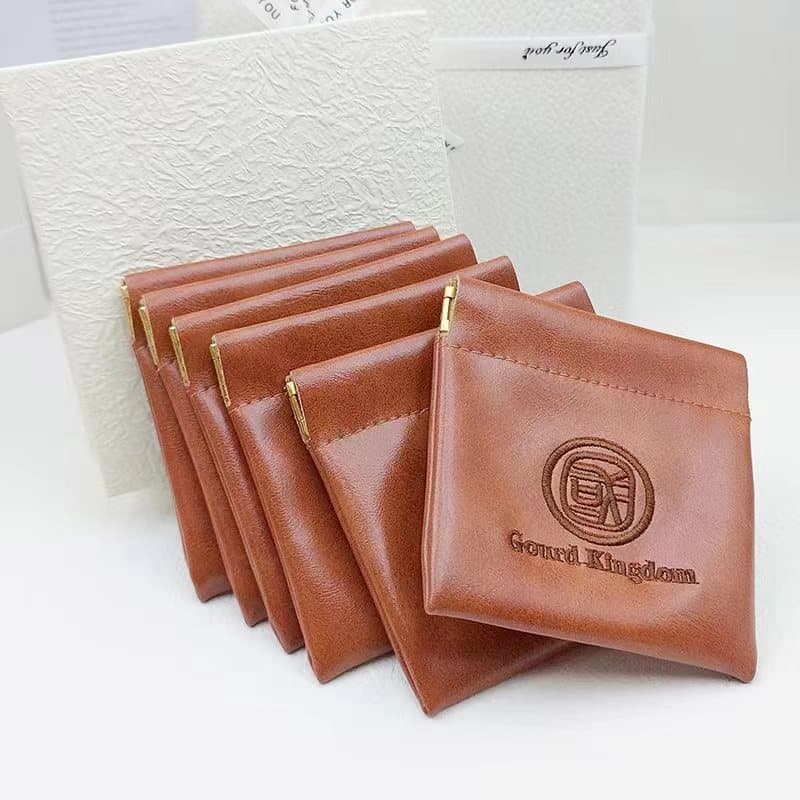 High-quality soft oiled leather snap closure, embroidered, embossed, silk-printed earphone, data cable, charger, earring, necklace storage bag, waterproof.