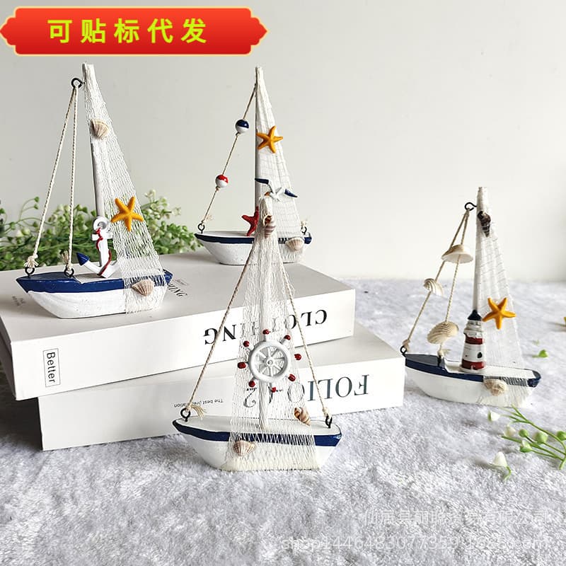 New Mediterranean home decor items: blue and white seashell sailboat handicrafts and gifts, symbolizing smooth sailing.