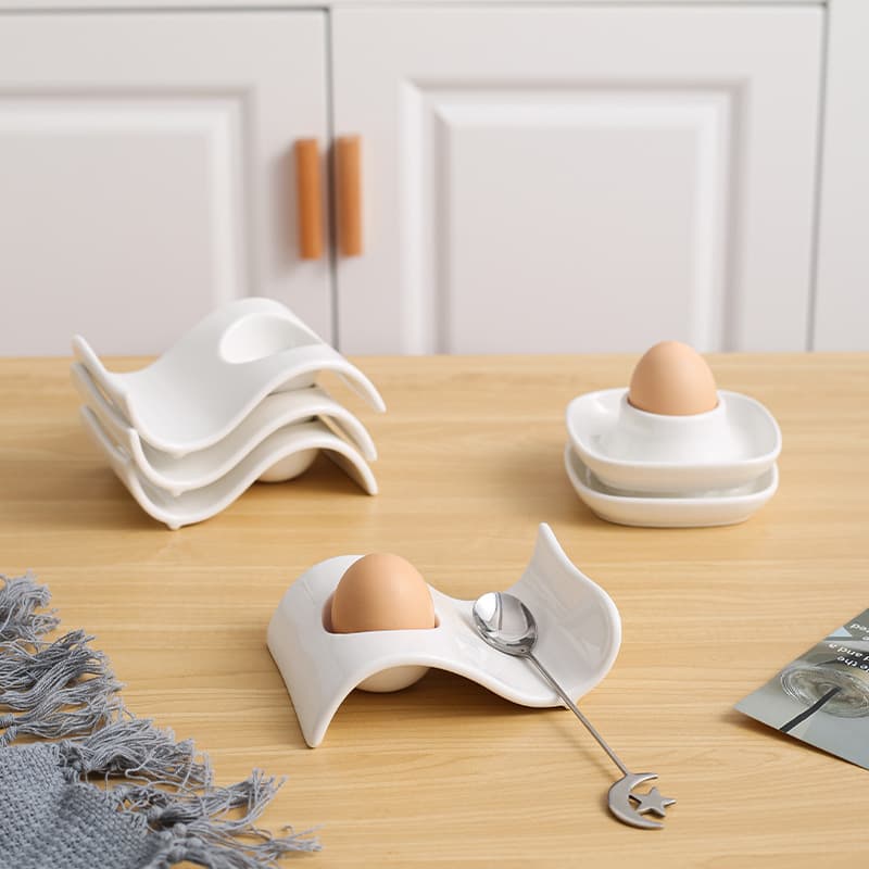 Ceramic egg cup, creative egg dish for breakfast, simple European-style kitchen egg holder in white for household use.