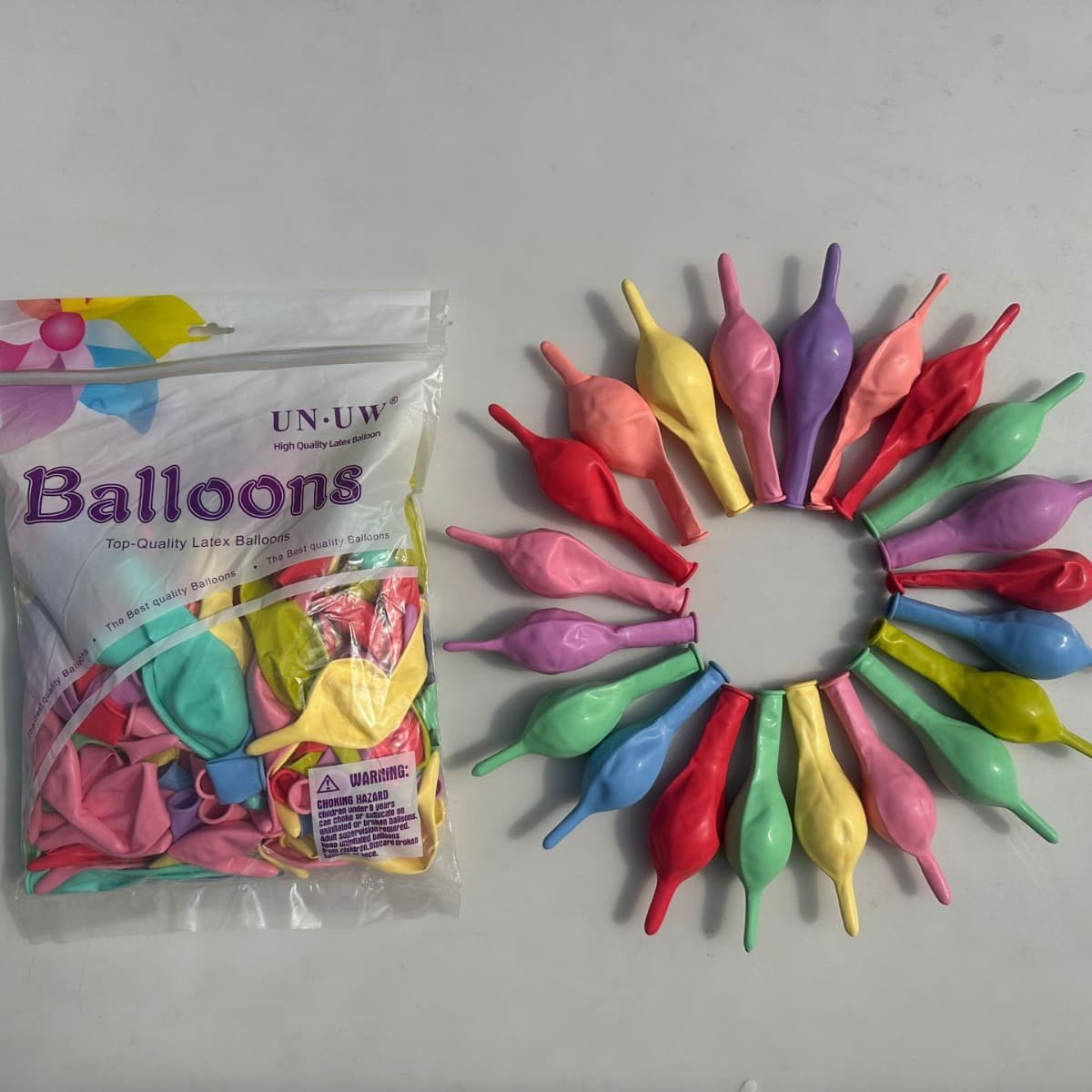 Manufacturer of domestic decorative 10-inch tail balloons, standard decorative pin tail balloons, wedding arrangement latex balloons