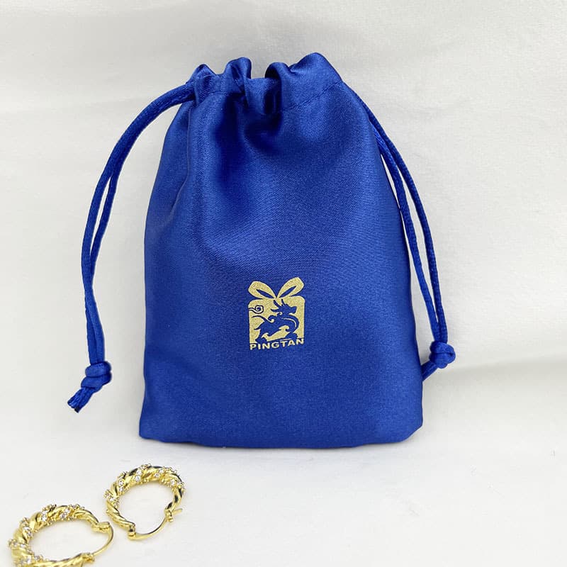 Custom blue faux silk drawstring bag for bracelets, necklaces, earrings, accessories, eye mask, beauty device packaging