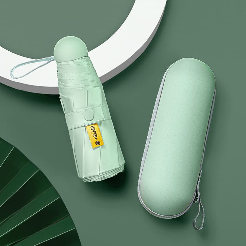 Pocket capsule five-fold sun and rain dual-use compact portable printed logo sun umbrella for women with UV protection.