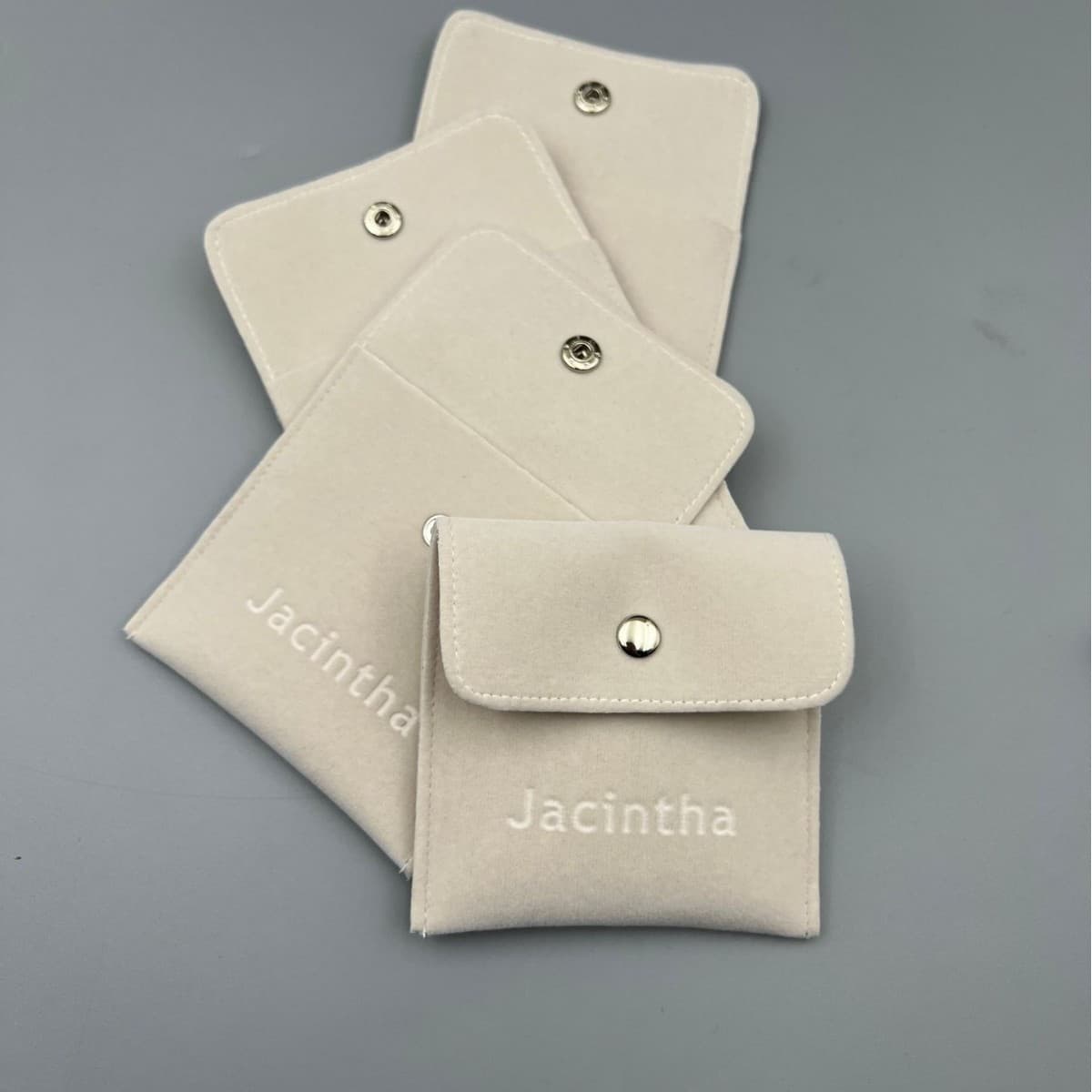 Custom jewelry and accessories, including snap pouches, necklaces, earrings, rings, brooches, crystal headpieces, and high-end velvet bags. Free design available.