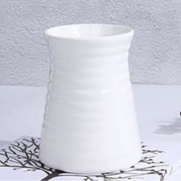Simple modern spiral striped ceramic vase, colored glaze, home decoration, flower vase