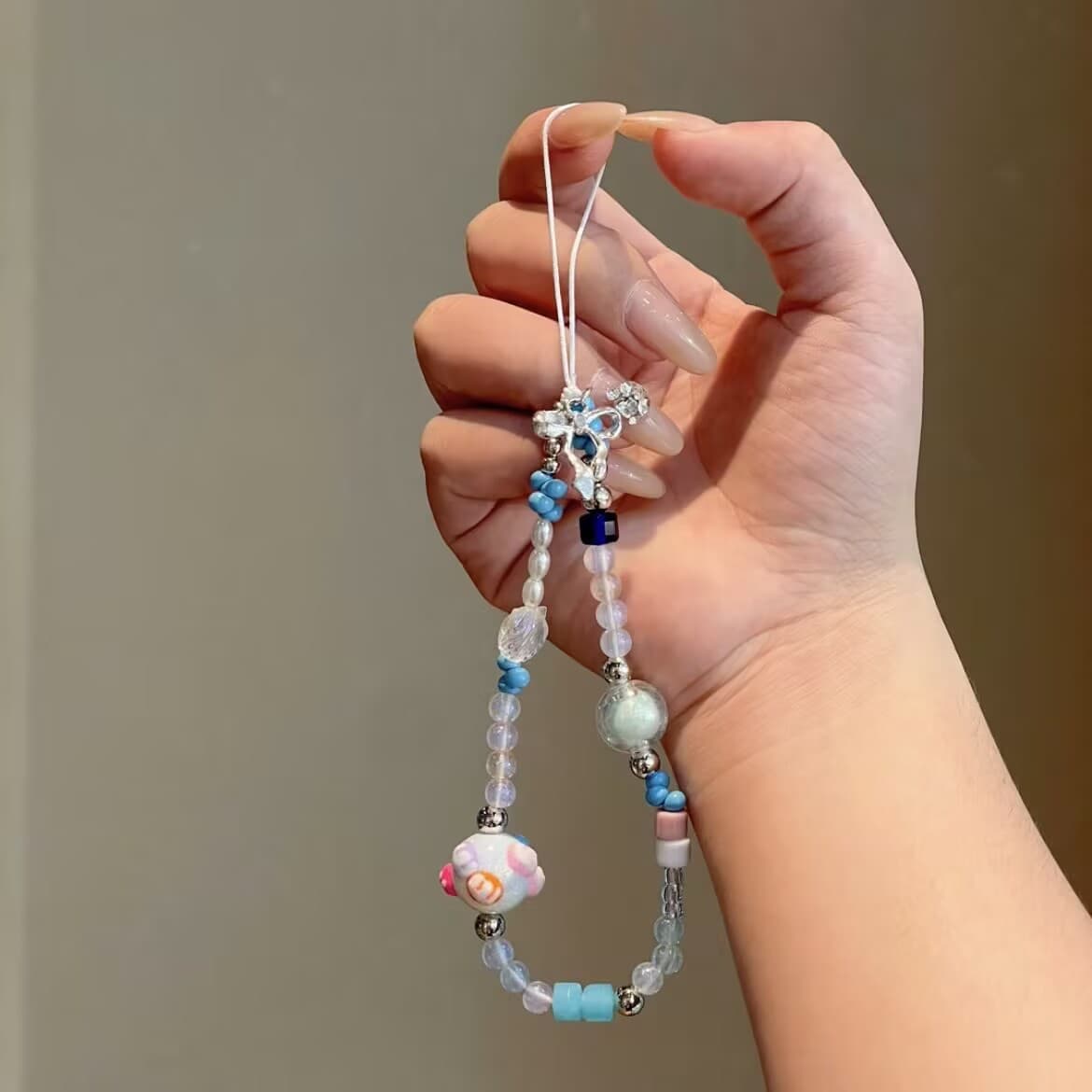 Cute bow shell beaded mobile phone case hanging chain diy handmade beaded chain ccd camera small fresh pendant