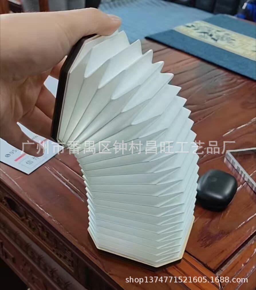 Origami accordion telescopic lampshade. Origami DuPont paper telescopic lampshade.