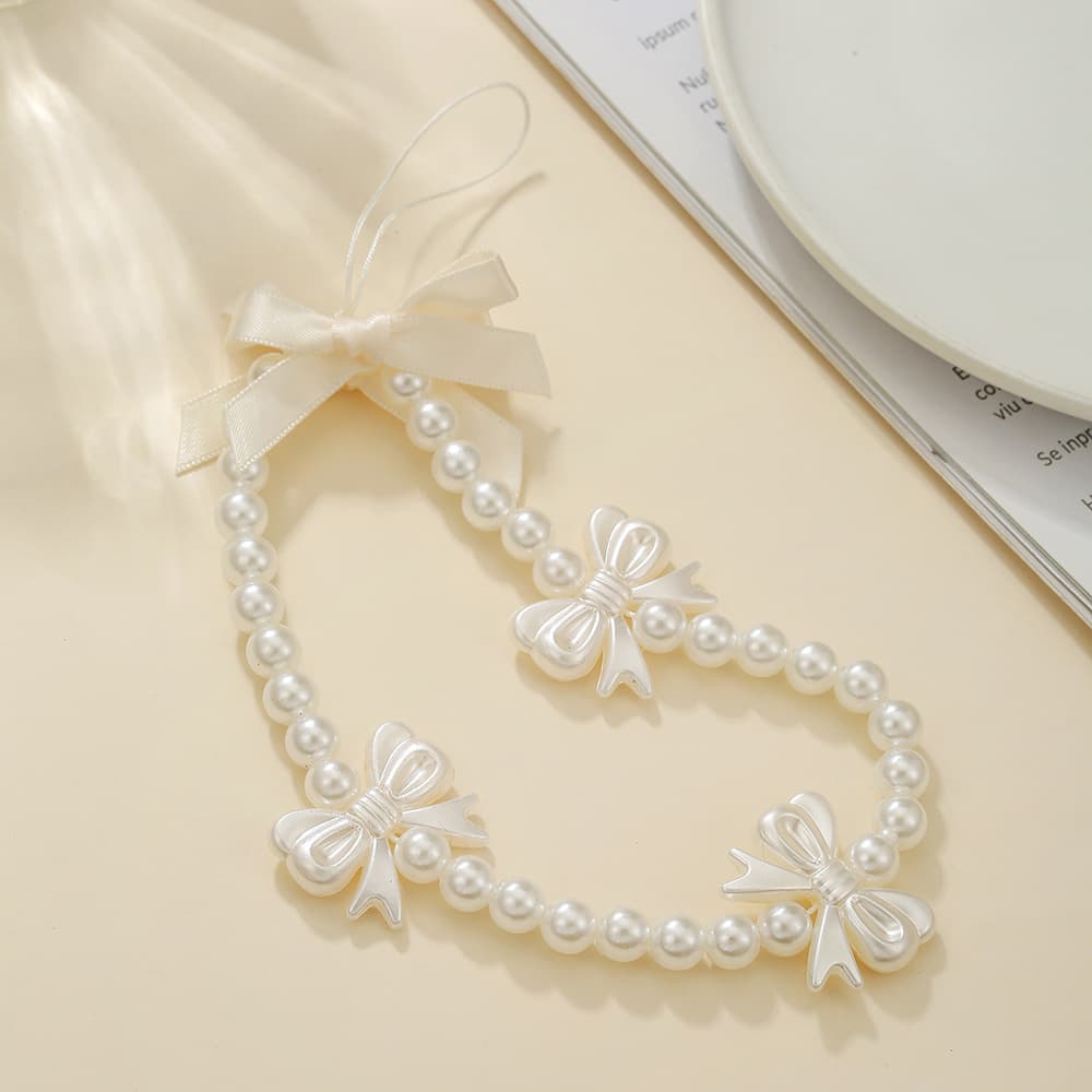 New bow mobile phone chain crossbody beaded lanyard wrist short pendant hanging chain imitation pearl mobile phone pendant